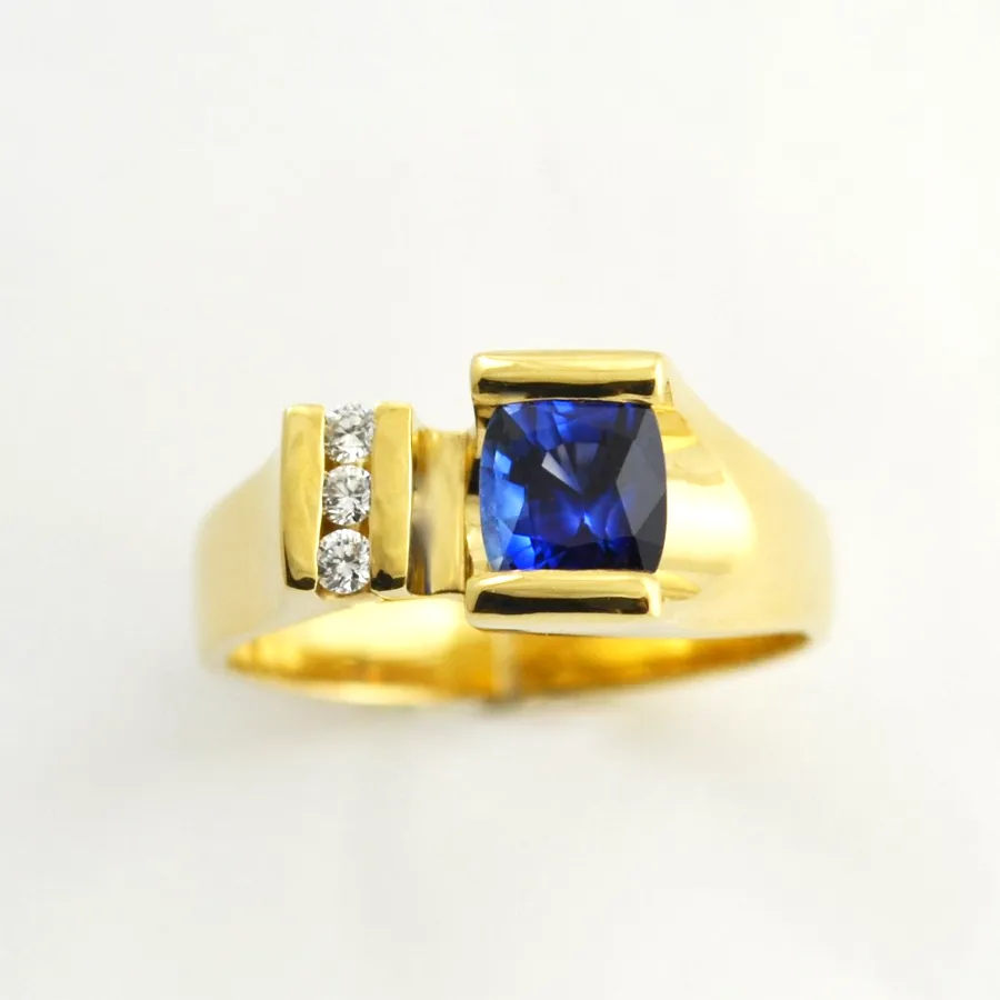 Cushion Cut Ceylon Sapphire Ring in a classically tailored style. Perfect "Ceylon blue" color accented with 3 channel set Diamonds (earth mined) by Sharon Teaman