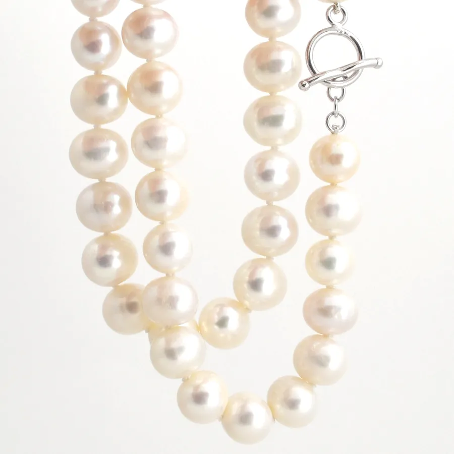 Freshwater White Pearls Round-ish Pearls Fabulous look for little cost! by Sharon Teaman