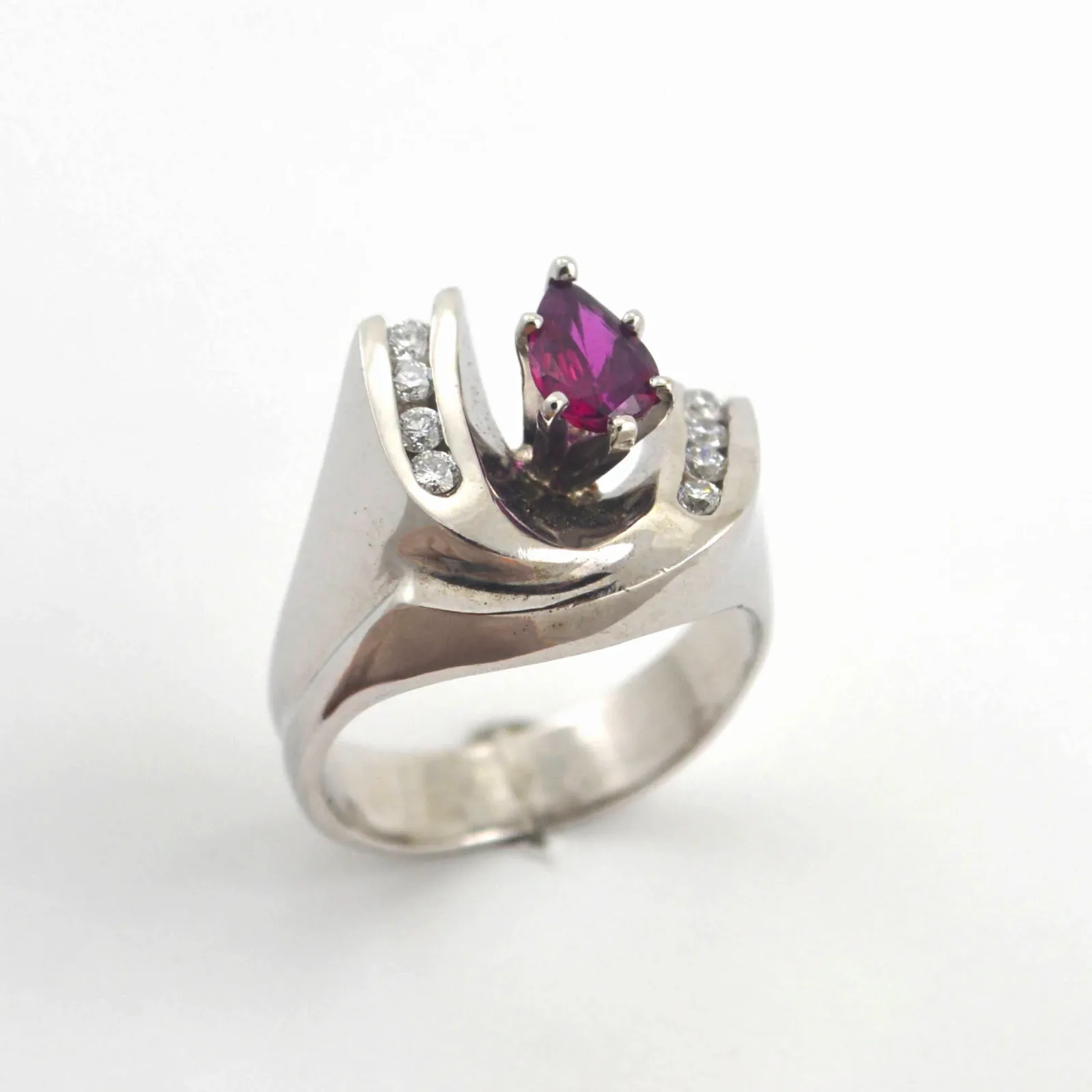 Ruby 240 14K W PEAR cut Ruby with a Double Diamond Arch surrounding this beautiful grem. by Sharon Teaman — view 3
